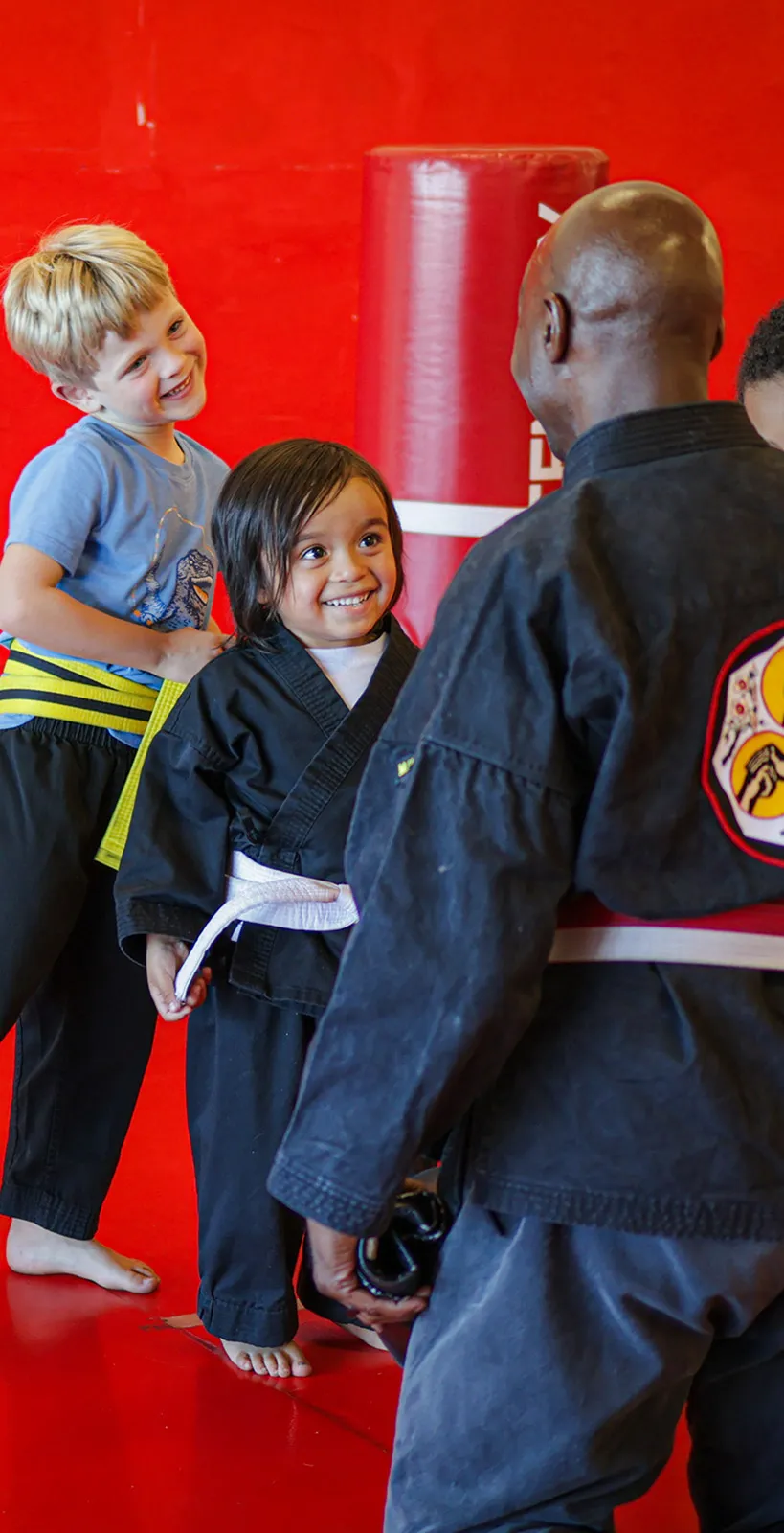 Confident young student standing tall in a kids martial arts class at James Martial Arts Academy in El Cajon